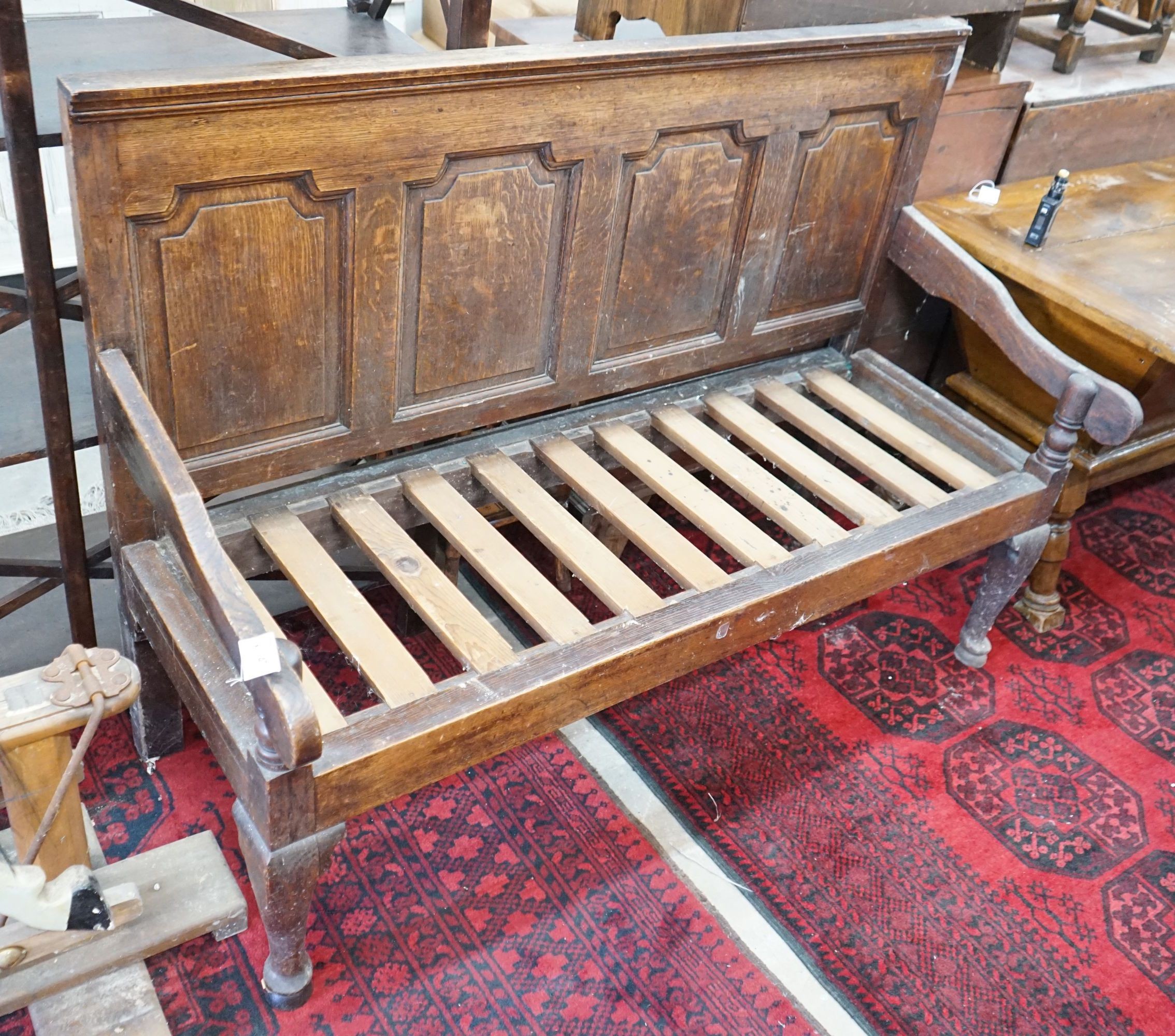 A George III oak settle, length 148cm, depth 60cm, height 106cm